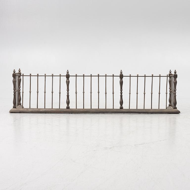 An English brass fire gate, circa 1800.