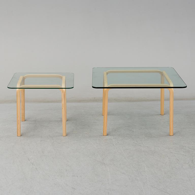 ALVAR AALTO, a pair of birch glass-top side tables from Arkek, Finland.