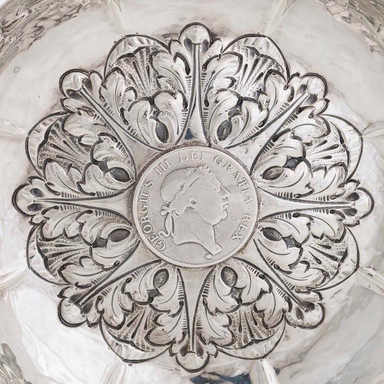 A 20th-century silver dish with a 3 shilling coin dated 1813.