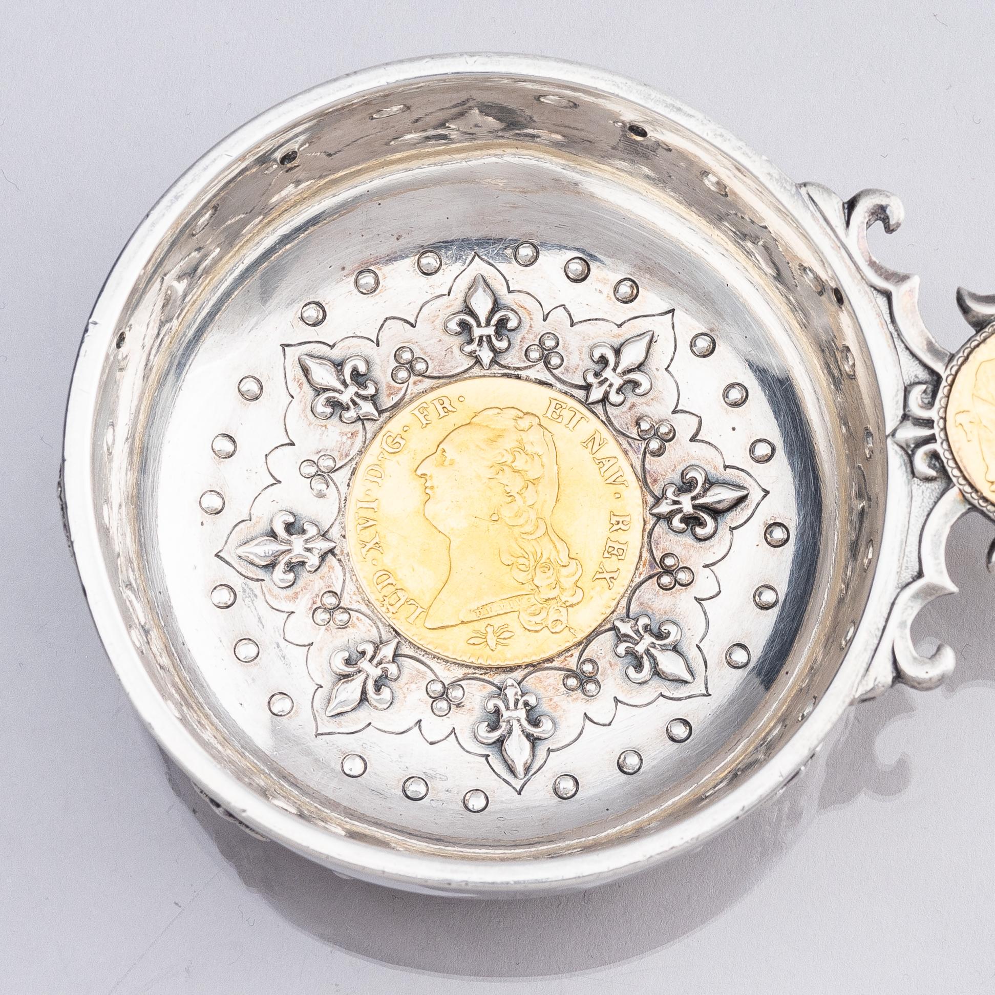 An 18th century French parcel-gilt silver tasse du vin (wine taster).