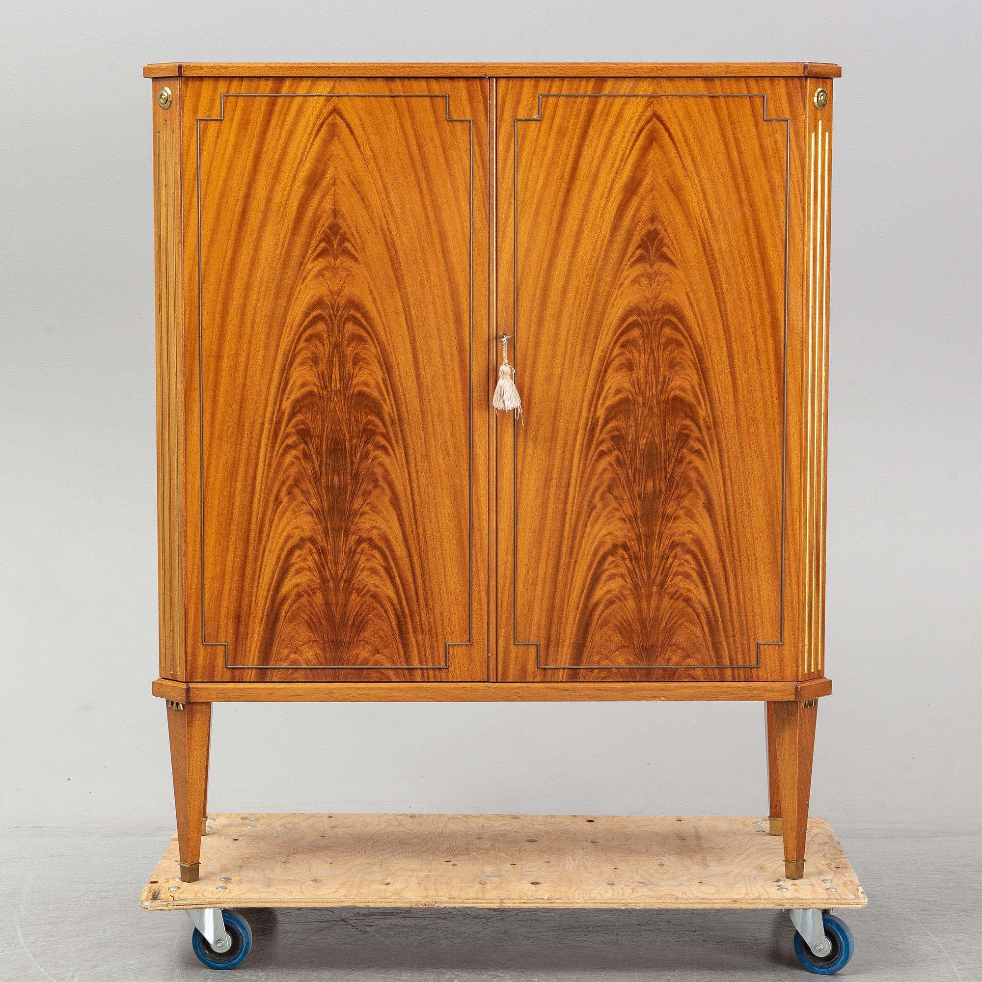 A mid 20th century mahogany veneered cabinet, Bodafors.