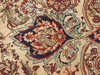 A carpet, an antique Kerman Laver, ca 677-688,5 x 510,5-526 cm.