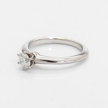 Tiffany & Co, a platinum solitaire ring with a brilliant-cut diamond.