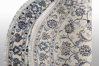 A rug, Nain, part silk, ca 146 x 146 cm.