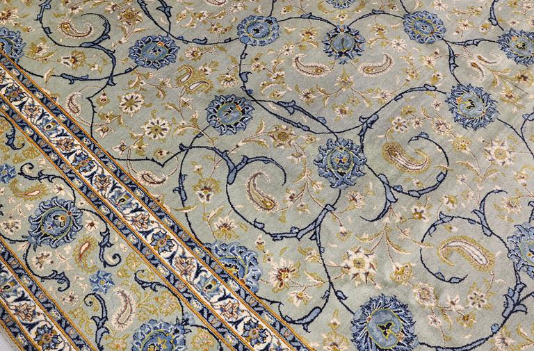 A Royal Keshan carpet, signed, 410 x 307 cm.