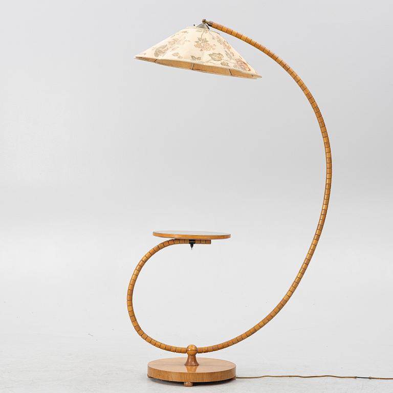 A 1930's/40's floor lamp with table.