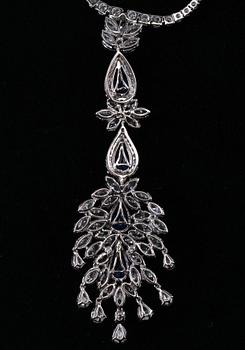 A SET OF JEWELLERY, brilliant- navette- and drop cut diamonds c. 19 ct. Ceylon sapphires c. 15 ct. Weight 49 g.