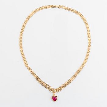 18K gold necklace with synthetic red stone heart charm.