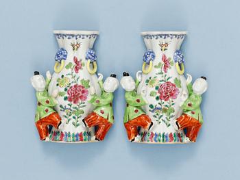 1592. A pair of famille rose wall vases, Qing dynasty, Qianlong (1736-95).