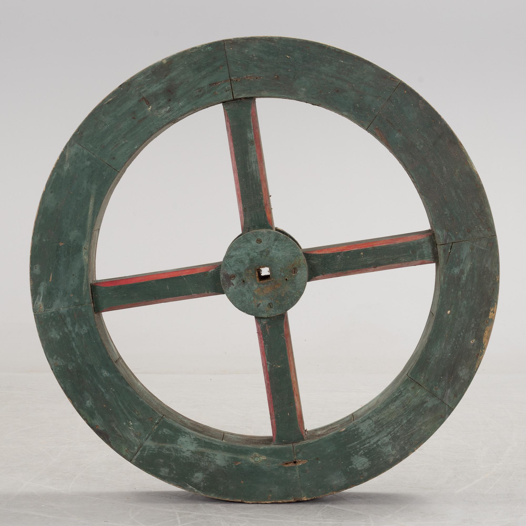 A early 20th century wooden wheel.