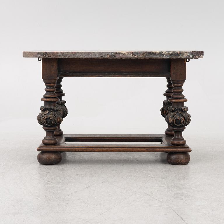 A 19th century Baroque style stone-top table.