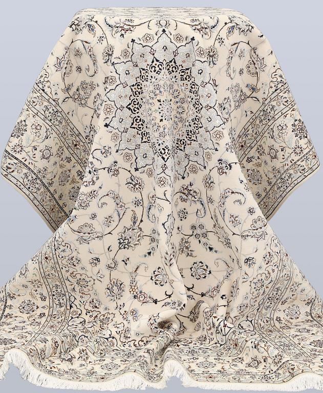 A Nain, part silk carpet, 305 x 207 cm.