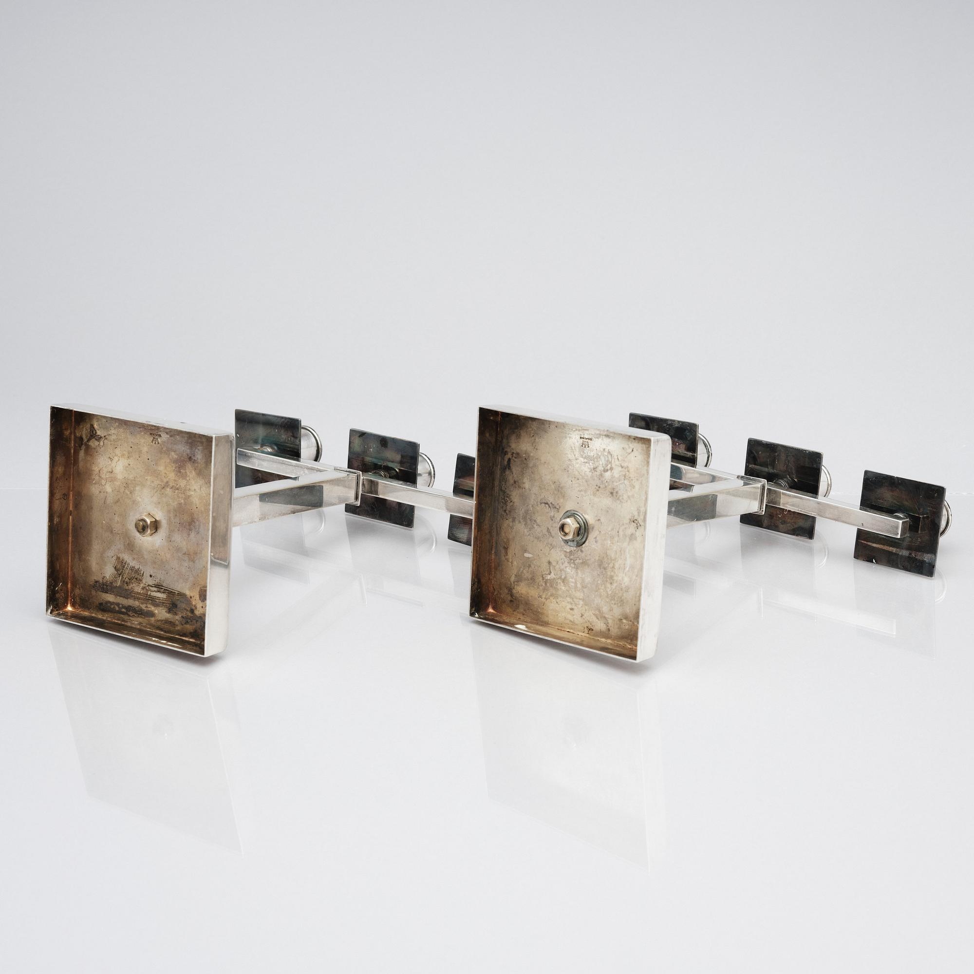 Rolf Engströmer, attributed to, a pair of silver plated candelabra, Fabriksaktiebolaget Kronsilver, Sweden 1930s.