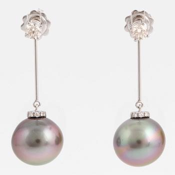 A pair of cultured Tahiti pearl and brilliant-cut diamond earrings.