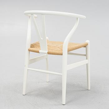 Hans J. Wegner, a model CH-24 chairs, Carl Hansen & Søn, Denmark.