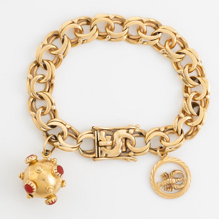 Gold charm bracelet.