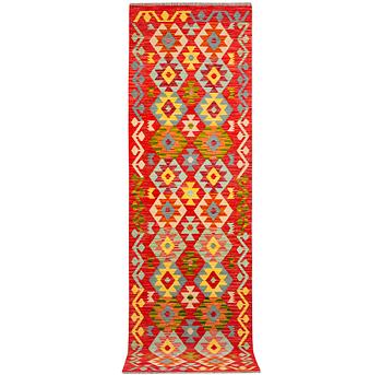An Afghan kilim runner, c. 301 x 83 cm.