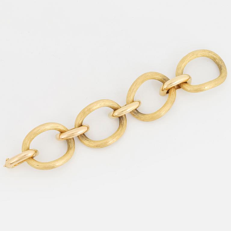 An 18K gold bracelet.