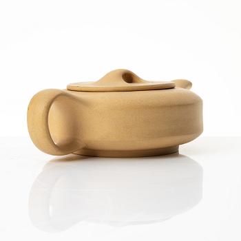 A set of a yellow yixing 'gongfu' teapot and four cups, China, 1980s.