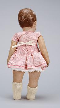 A 1930s century doll, resembling Käthe Kruse.