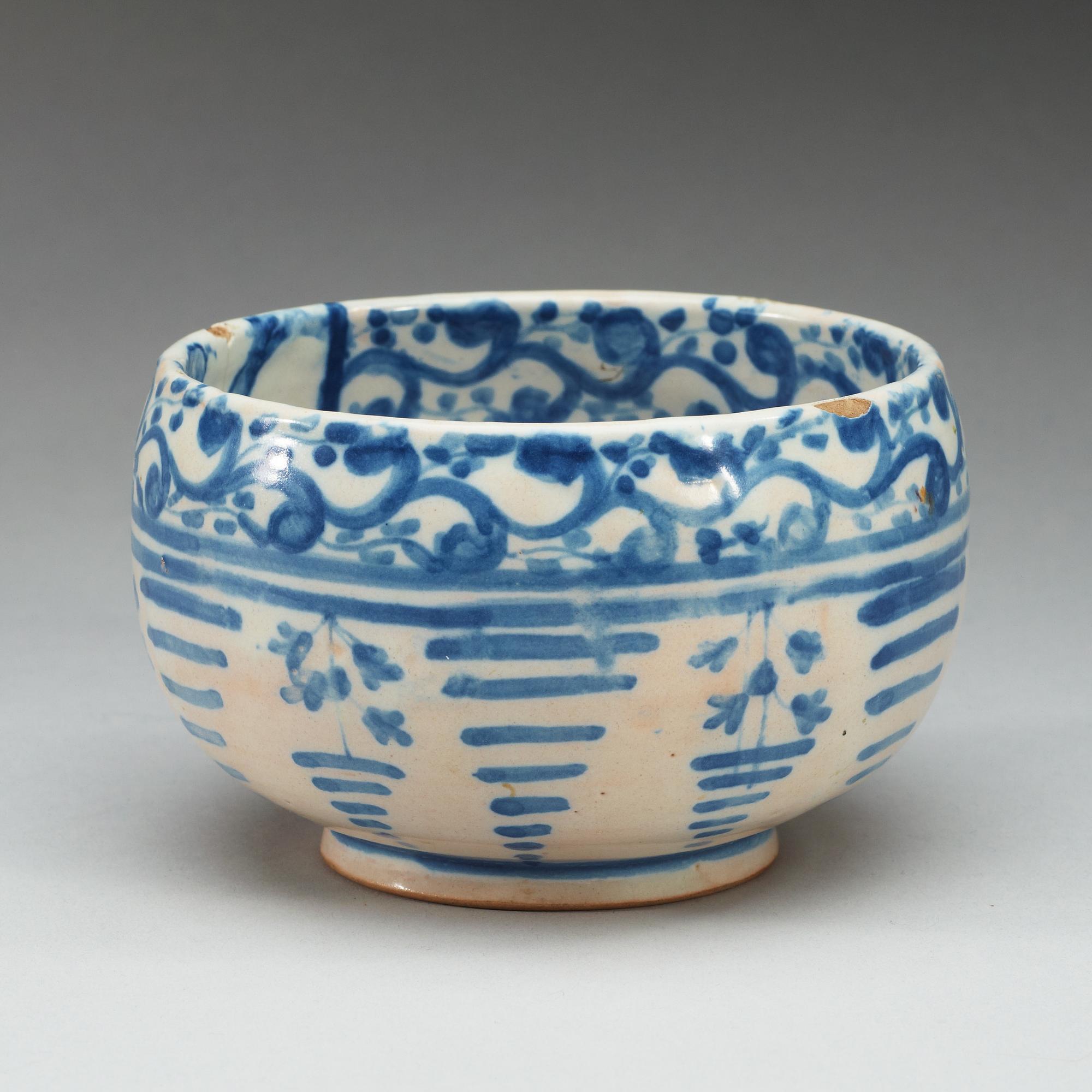A Spanish faience blue and white bowl. Marked Talavera, presumably 18th Century.