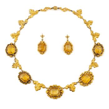 509A. En collier och ett par örhängen 14K guld med fasettslipade citriner.