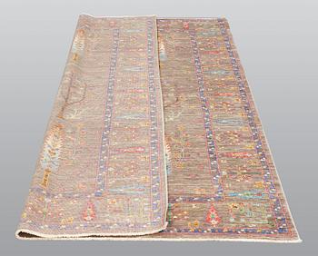 A rug, Ziegler design figural, ca 241 x 169 cm.
