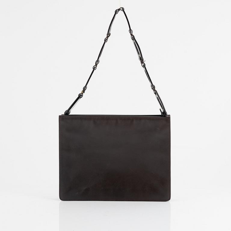 Gucci, a handbag.