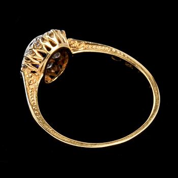 RING, 18k guld med blå safir samt 11 briljantslipade diamanter.