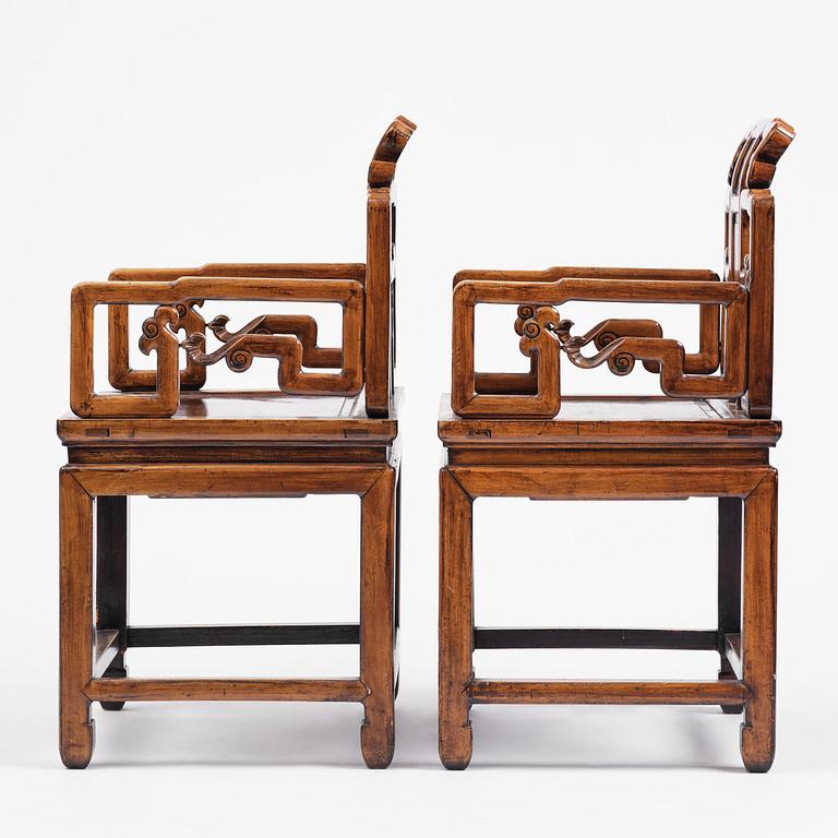 A pair of hardwood armchairs, late Qing dynasty.