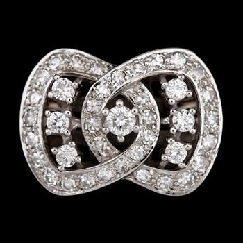 100. CLASP, brilliant- and eight cut diamonds, tot. app. 1.20 cts.
