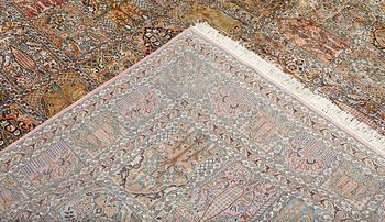 A Kashmir silk carpet, 418 x 297 cm.