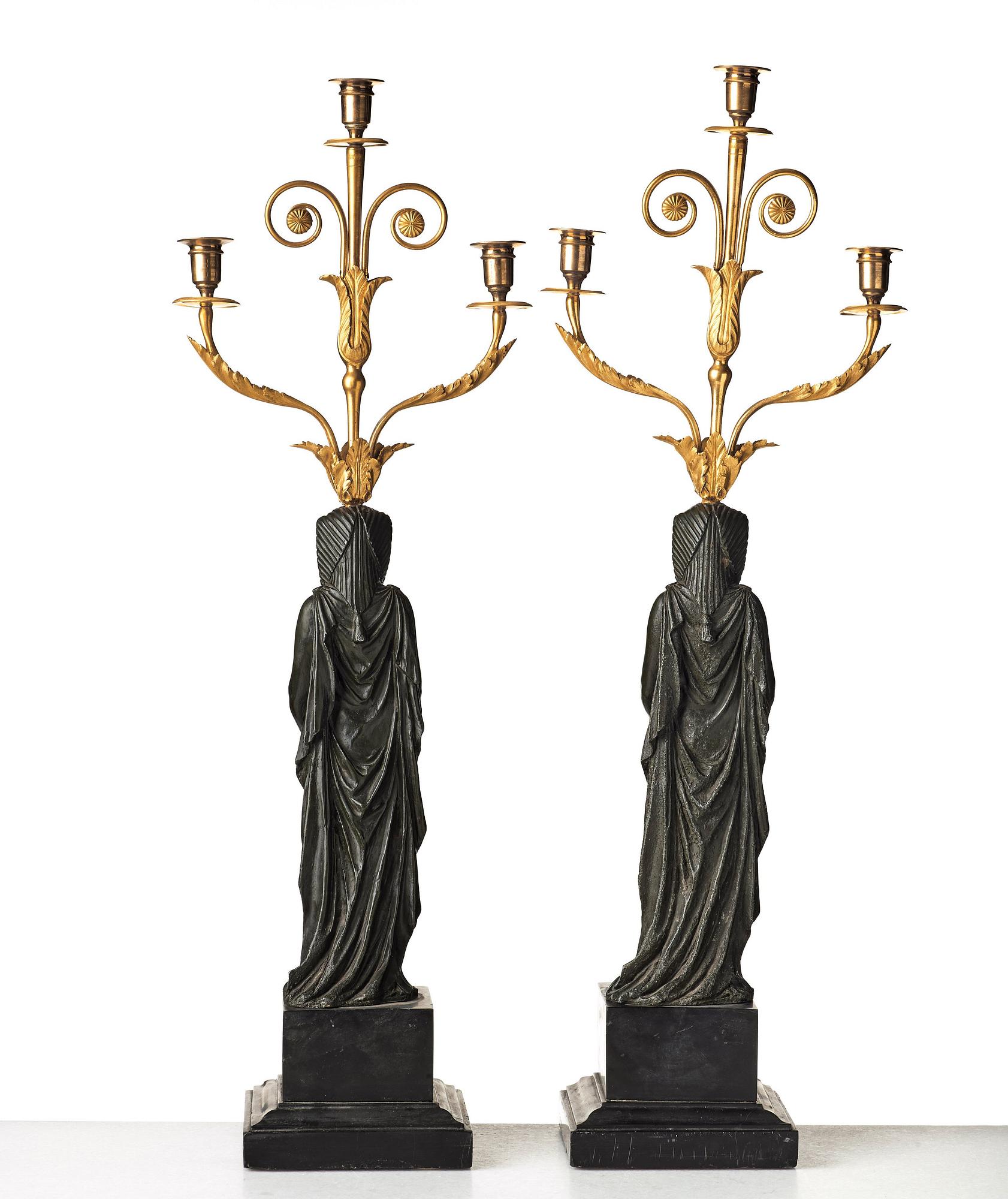 A pair of French Empire early 19th century three-light candelabra.