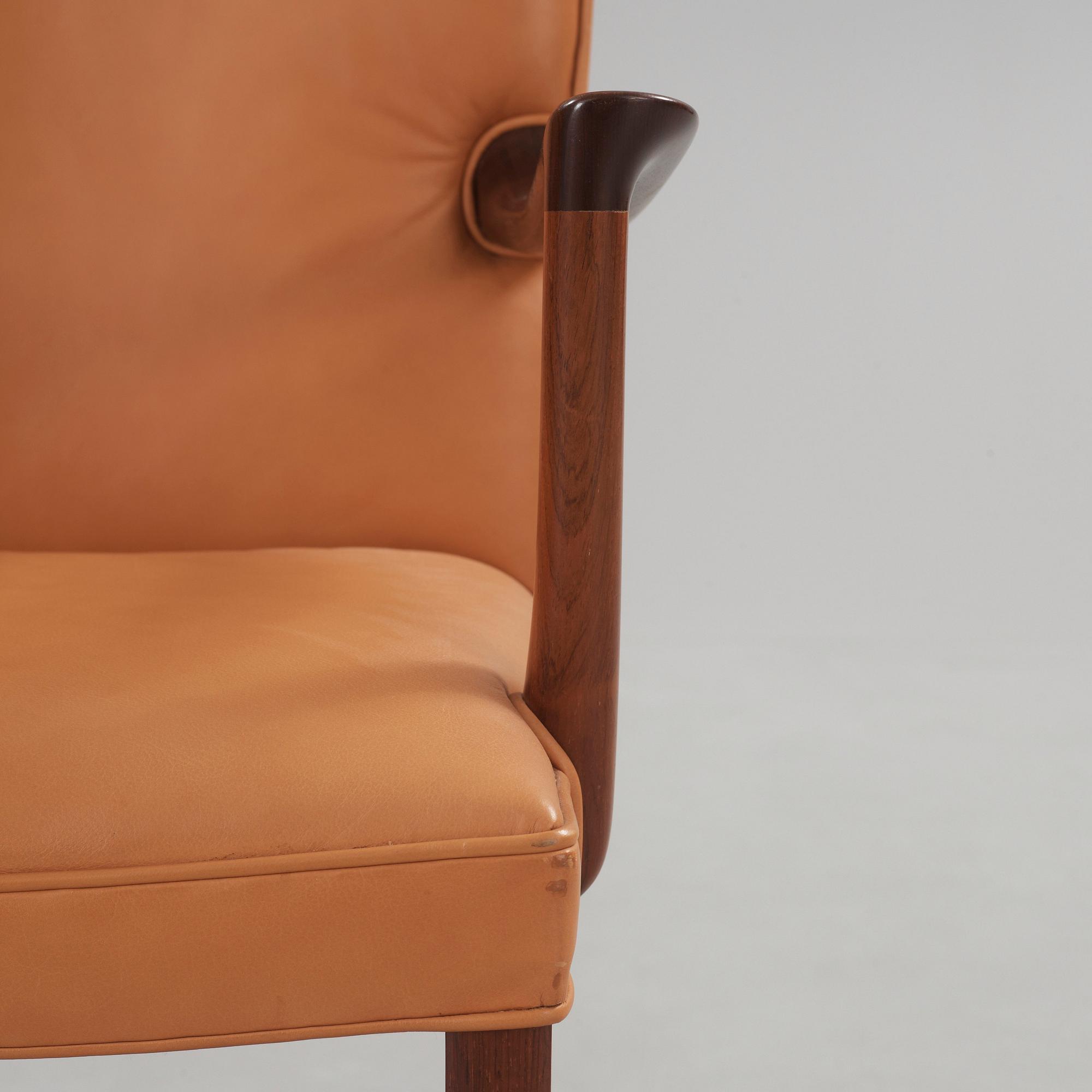 A pair of Ole Wanscher palisander armchairs, Denmark 1960's.