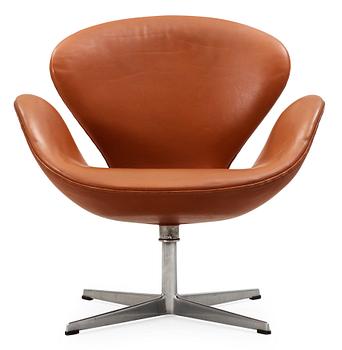 An Arne Jacobsen brown leather 'Swan' chair, Fritz Hansen, Denmark 1960's.