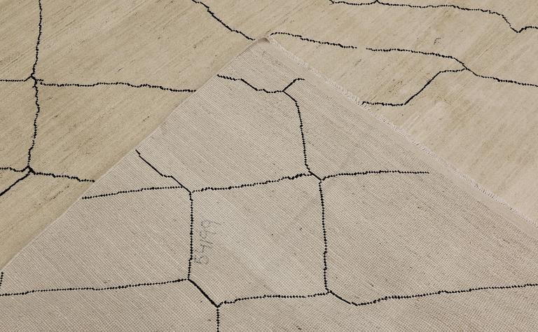 A Moroccan carpet, 305 x 251 cm.