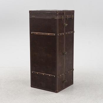 A leather suitcase-shaped bar cabinet.