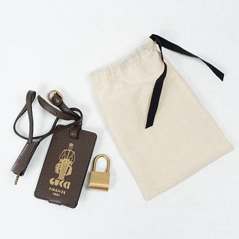 Gucci, suitcase / cabin bag.