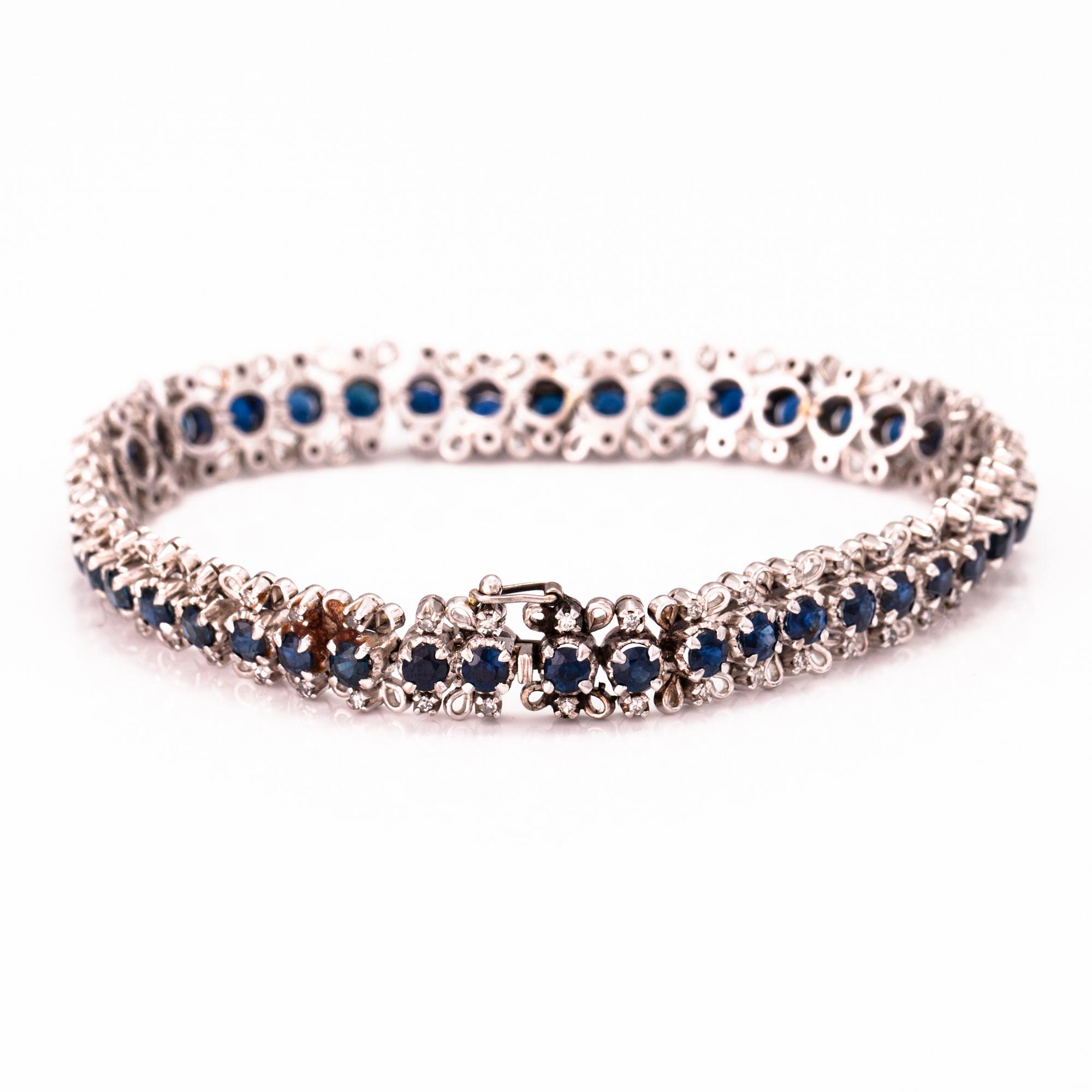 A white gold bracelet with sapphires and 8/8 cut diamonds ca. 0.75 ct in total.