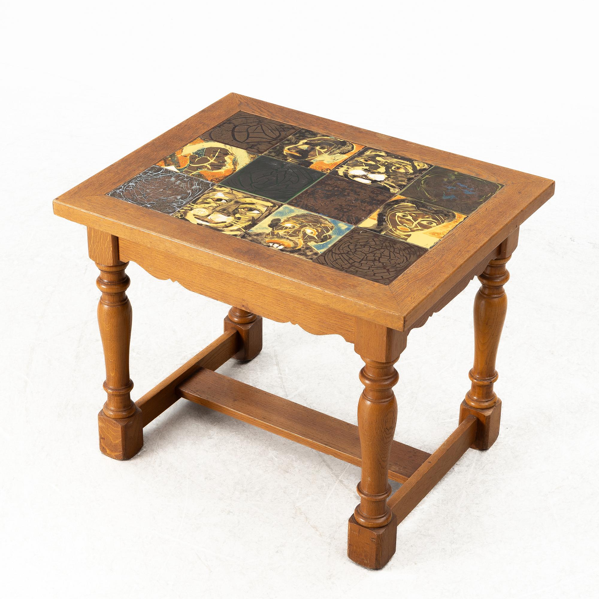 Allan Ebeling, table with various ceramic tiles, Torshälla, mid 1900s.