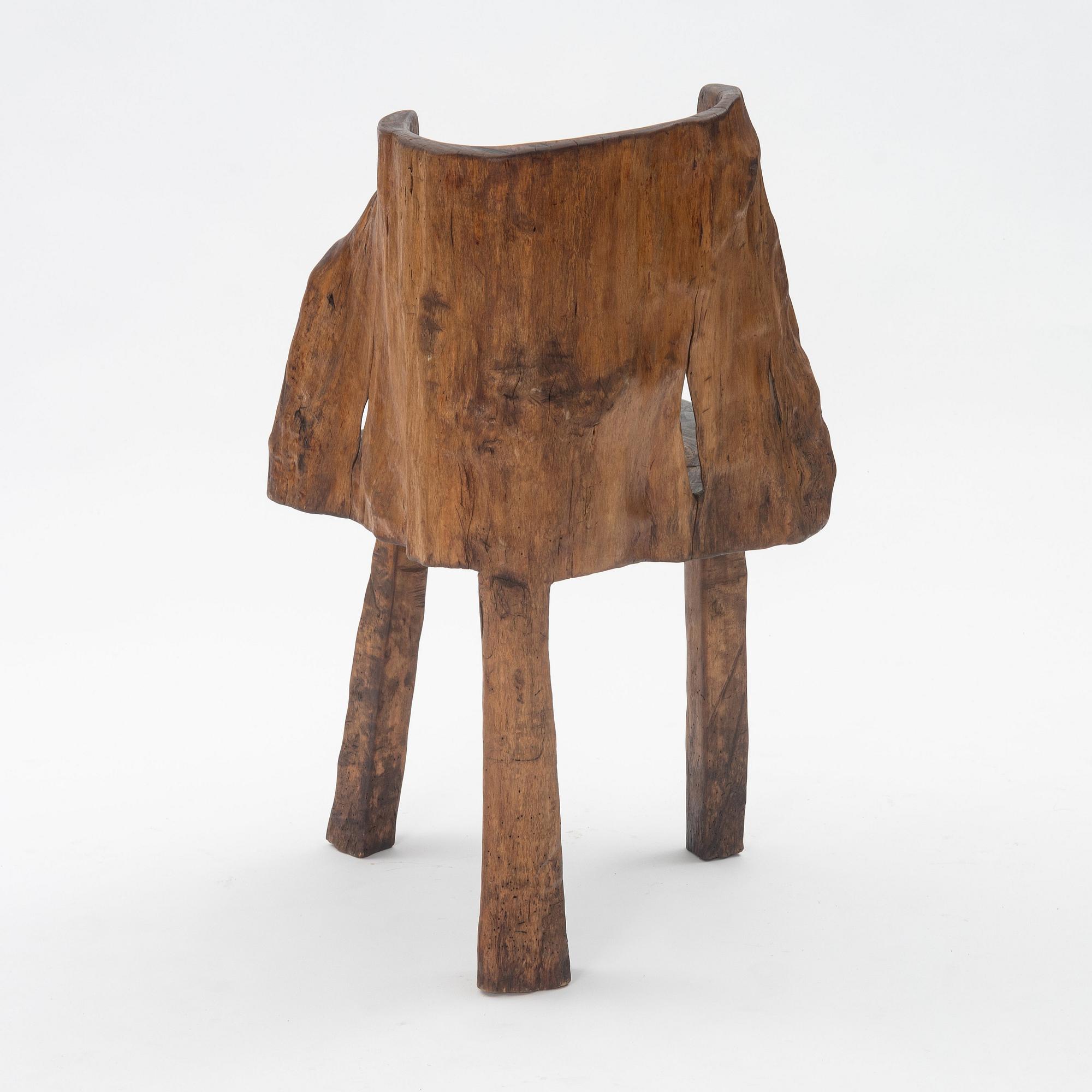 A one piece carved armchair, Sweden early 20th century.