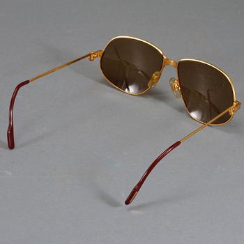 SOLGLASÖGON, Cartier.