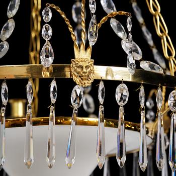 A late Gustavian gilt brass and cut glass four-light chandelier, Stockholm, late 18th century.