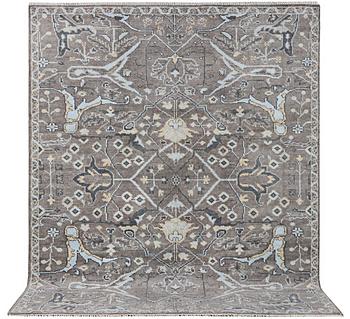 An Oriental carpet with Mamluk design, c. 303 x 246 cm.