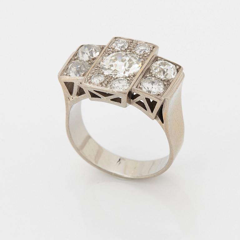 An 18K white gold ring set with old-cut diamonds.