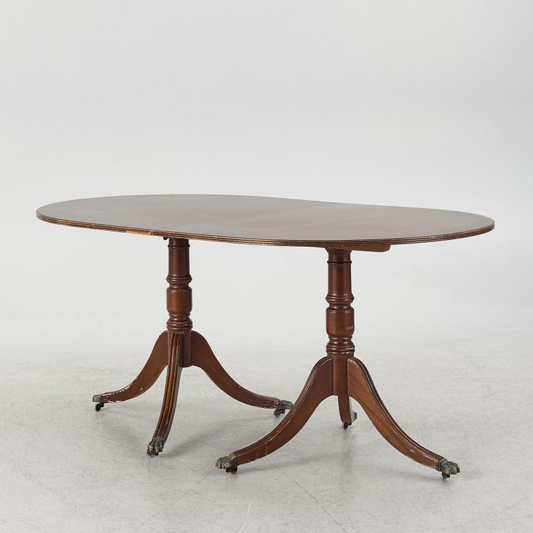 A dining table, 20th century, England.