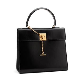 669. CÉLINE, a black leather top handle purse.