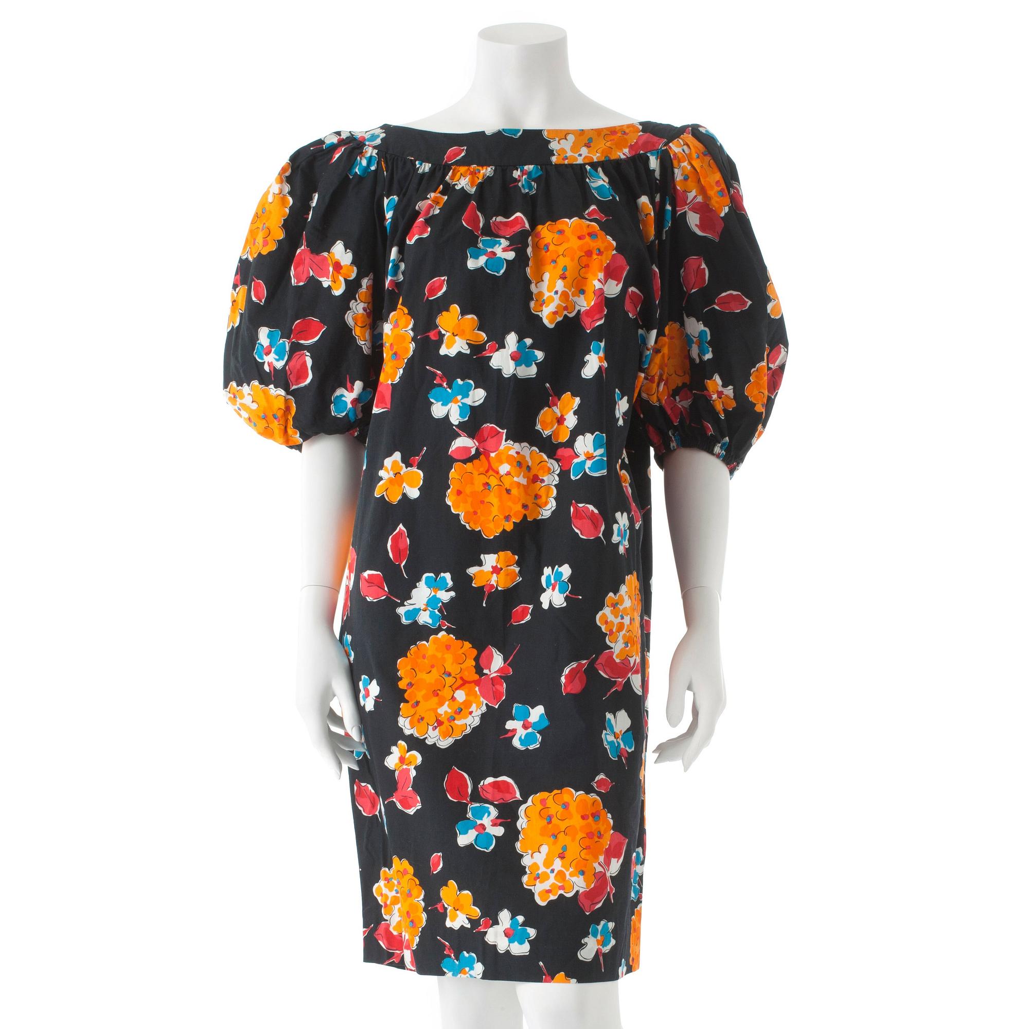 YVES SAINT LAURENT, a black cotton dress with flower motif.