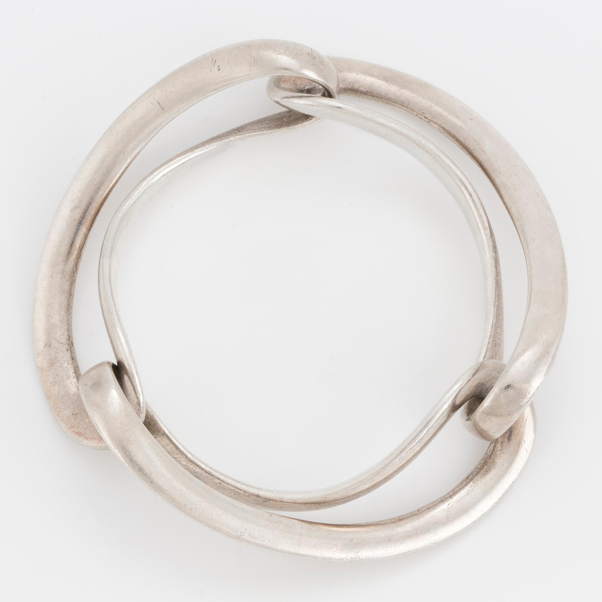 An 'Infinity' silver bracelet by Georg Jensen.