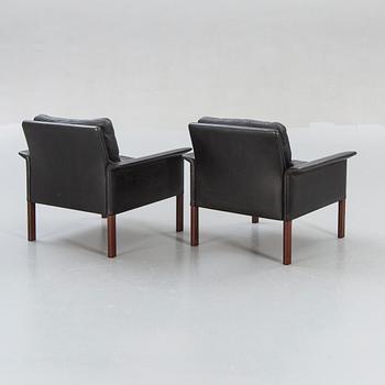A pair of 1960s leather easy chairs.